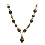 Tiigrisilm. Kaelakee keskmine osa. Metallosad: kuldset värvi.